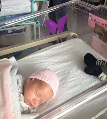 The Heartbreaking Meaning Behind a Purple Butterfly Sticker Near a Newborn