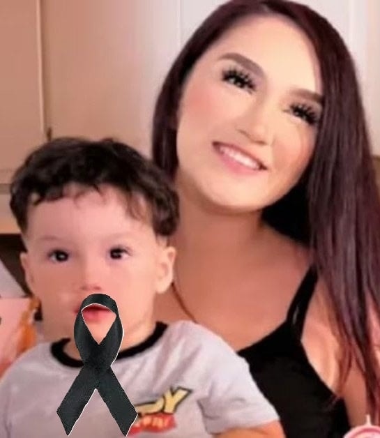 Young woman puts son inside the fir… See more